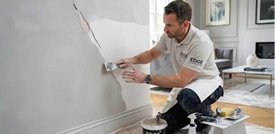 Residential wall plaster repair and smooth surface finishing